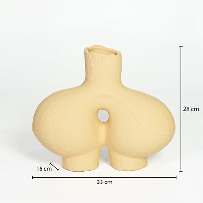 Beige ceramic abstract vase 28 cm height 33 cm width ideal for console table and living room decor.