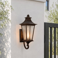 Traditional bronze metal outdoor wall lantern for porch entrance garden and exterior walls with warm ambient lighting.