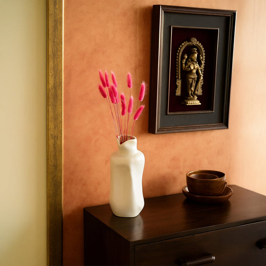 Vibrant pink bunny tail grass arranged in a cozy home scene bringing soft fluffy texture to interior decor.