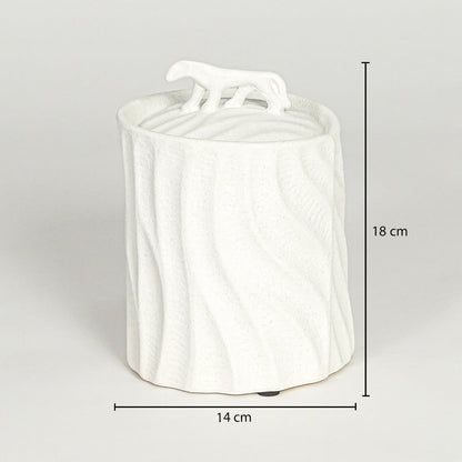 White ceramic decorative jar with sculpted lid showing 18 cm height and 14 cm width suitable for table shelf or console placement.
