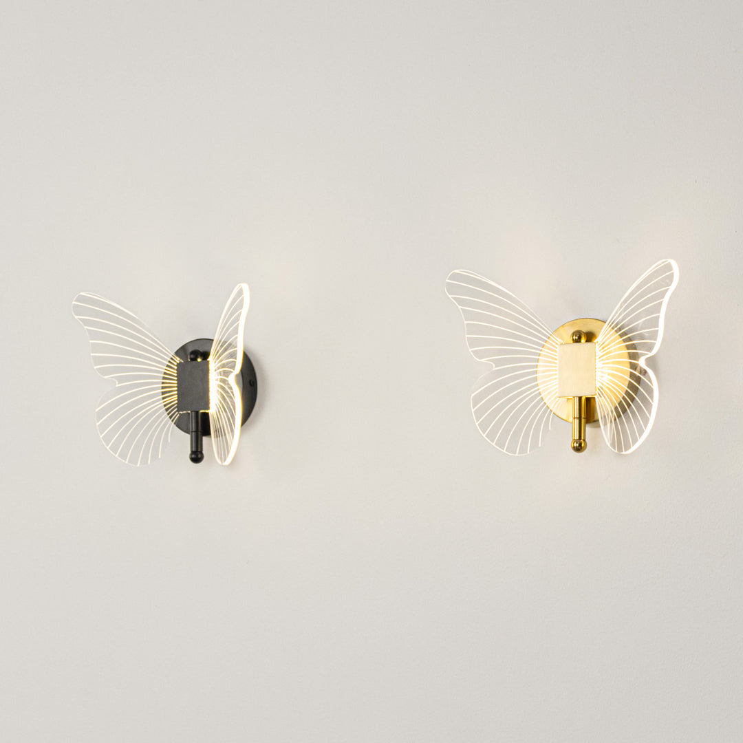 Modern wall light set in black and gold metal finish with textured glass design for bedroom or living decor lighting placement white background.