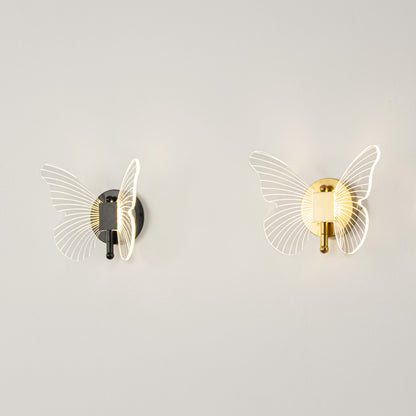Modern wall light set in black and gold metal finish with textured glass design for bedroom or living decor lighting placement white background.