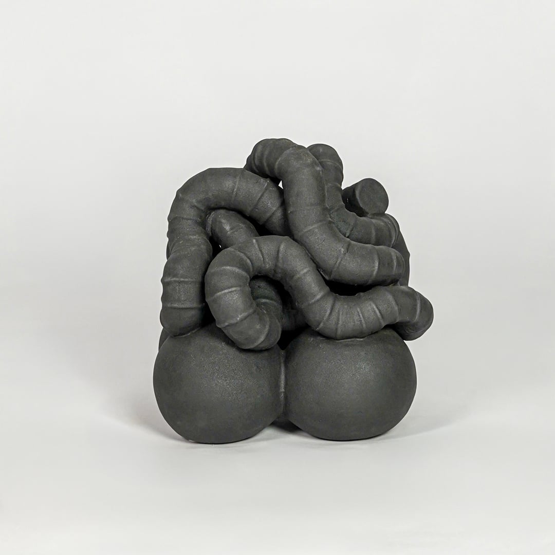 Black ceramic abstract decor sculpture modern decorative showpiece for table console shelf home decor styling.