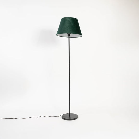 Dark green fabric shade floor lamp with slim black stand displayed switched off on white background.