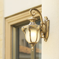Outdoor wall lamp enhancing a modern home exterior with warm illumination ideal for entrances patios and porches.
