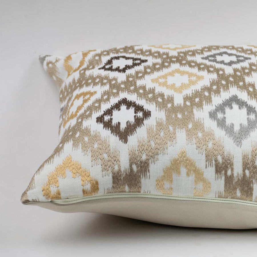 White cotton cushion cover with beige geometric pattern highlighting woven cotton fabric and refined stitched detailing.