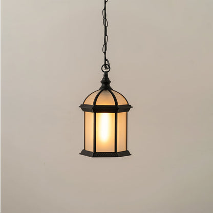 Black vintage hanging lantern on white background with light on showing warm frosted glow and classic dome top design ideal for exterior ceiling lighting.