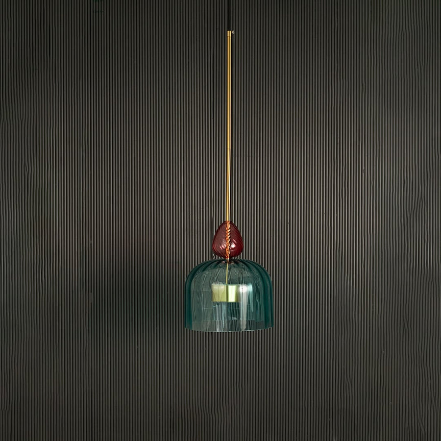 Turquoise glass pendant light with gold fittings showcasing artistic design for modern interiors.