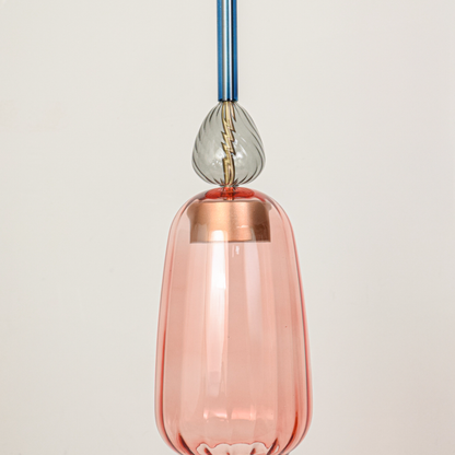 Detailed view of pink glass pendant light with transparent finish and refined decorative accents.