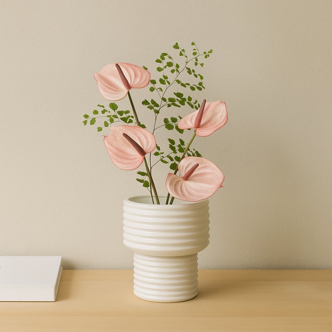 White ribbed ceramic vase styled in a modern interior perfect for consoles shelves and elegant minimal home decor accents.