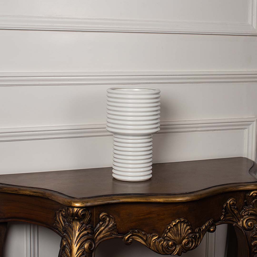 Modern tall white ceramic vase with ribbed design shown on white background perfect for floral and dried stem decor.
