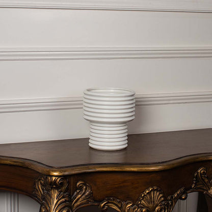 White ribbed ceramic vase displayed on a clean white background ideal for minimal home decor and contemporary tabletop styling.
