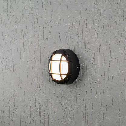 Round outdoor wall light with black metal frame and warm glow on white background for modern exterior lighting decor.
