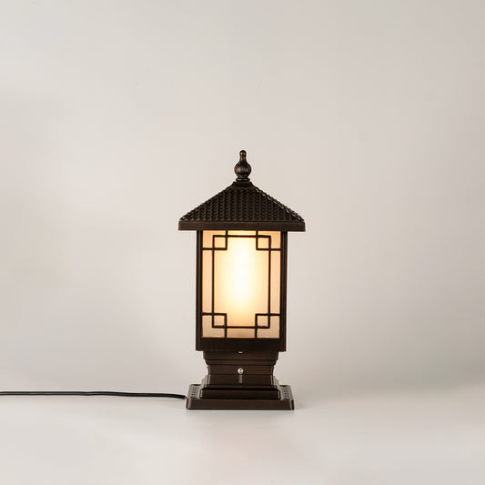 Vintage black outdoor gate light with warm ambient glow for luxury exterior decor styling use.