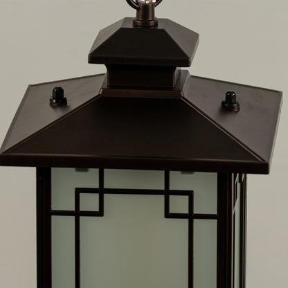 Closeup of black metal outdoor lantern with glass panels on white background ideal for gate entrance and exterior decor lighting.