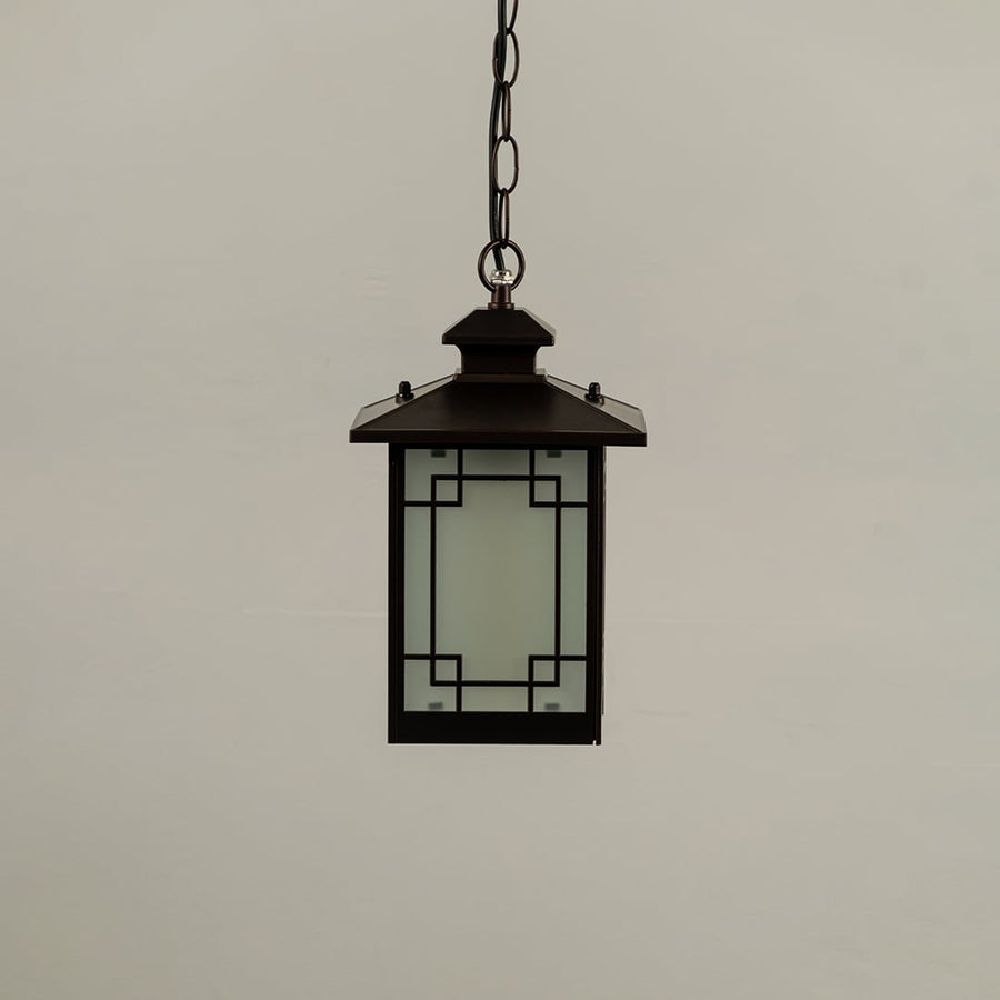 Black metal hanging lantern on white background with light off showing frosted glass panels and square geometric frame suitable for modern exterior ceilings.