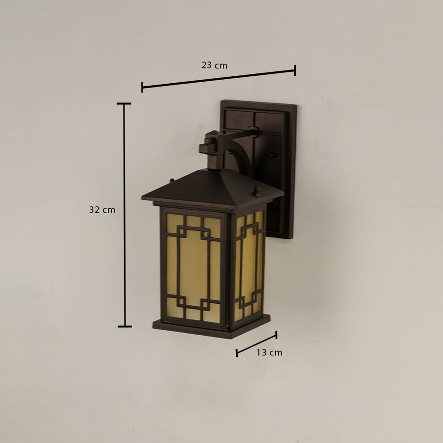 Brown metal outdoor lantern with frosted glass showing dimensions 32 cm height 23 cm width and 13 cm depth for precise placement on exterior walls.
