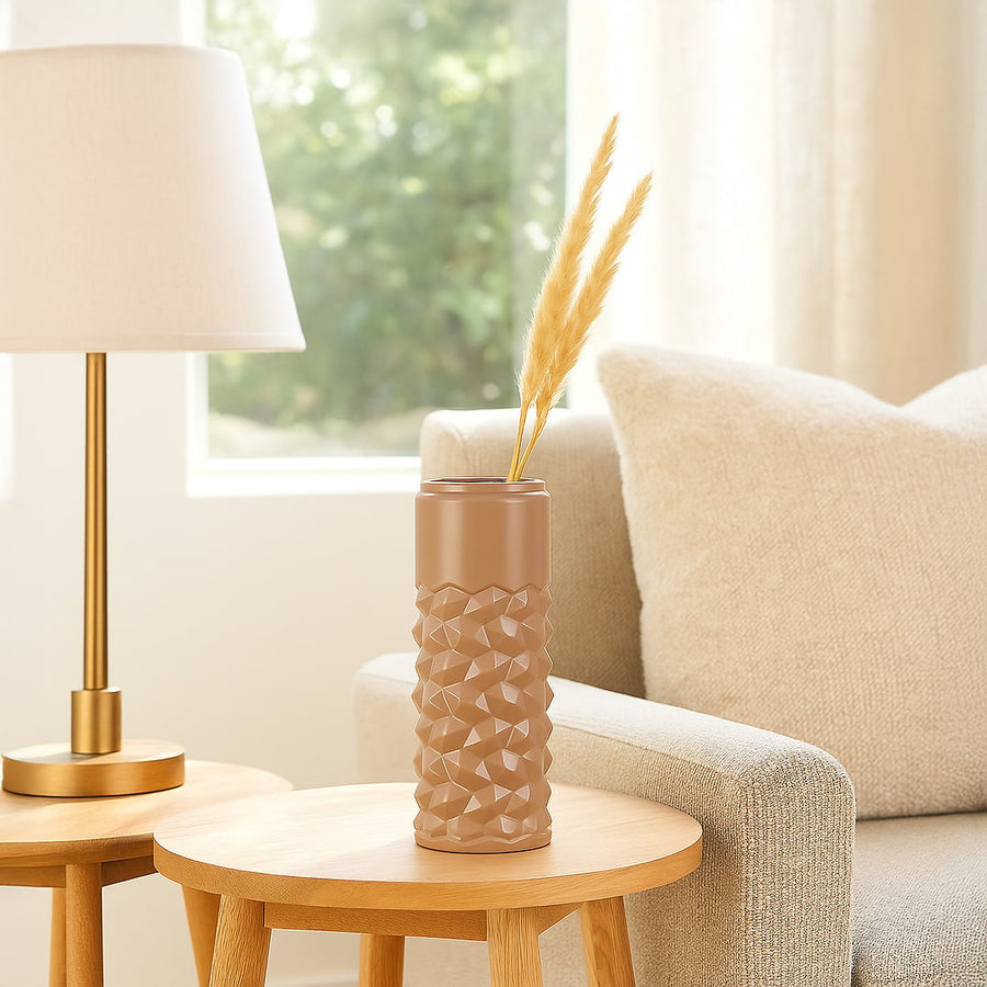 Tall textured beige vase styled in a soft lifestyle setup adding a modern decorative touch with its geometric pattern and minimal look.