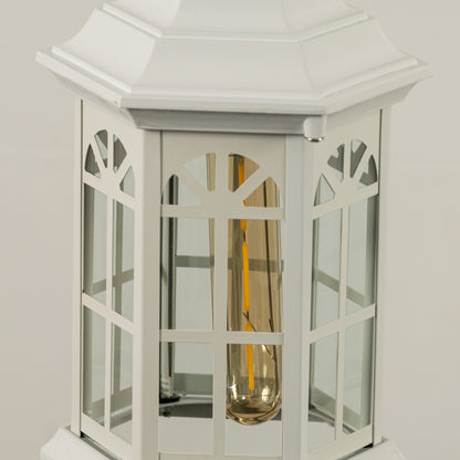 Closeup of white metal hanging outdoor lantern with glass panels on white background ideal for gate entrance and exterior decor lighting.