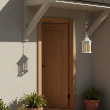 White hanging outdoor lantern with light on illuminating a porch near a wooden door casting a soft warm glow and creating an inviting exterior entrance ambiance.