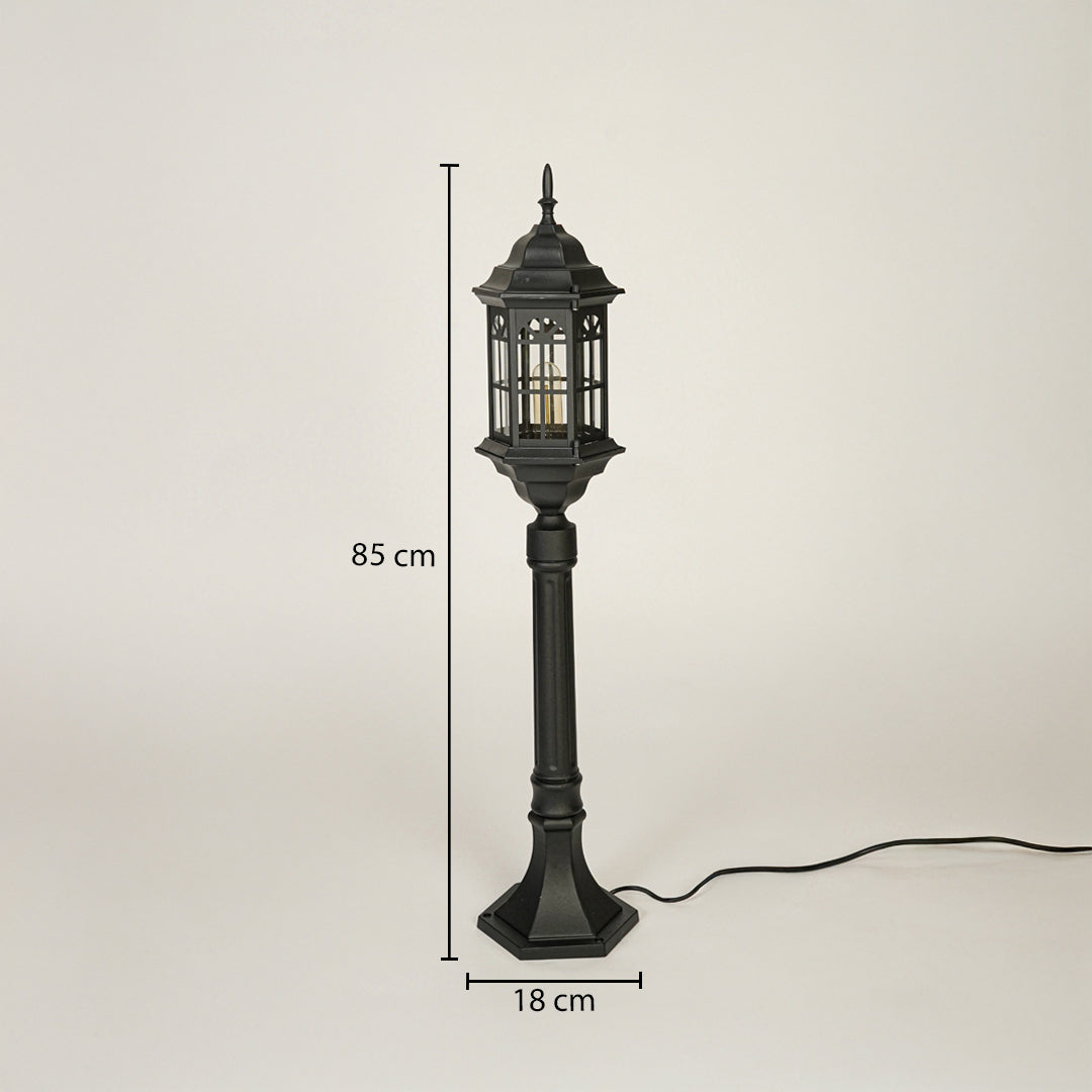 Vintage style outdoor lamp post with black metal frame and glass lantern design 85 cm height 18 cm base width ideal for garden pathway lighting.


