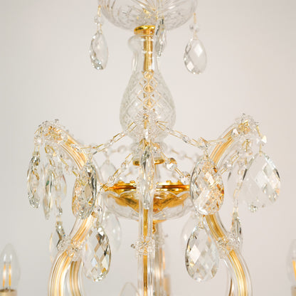 Closeup image of candelabra chandelier for luxury living room decor styling with polished finish.