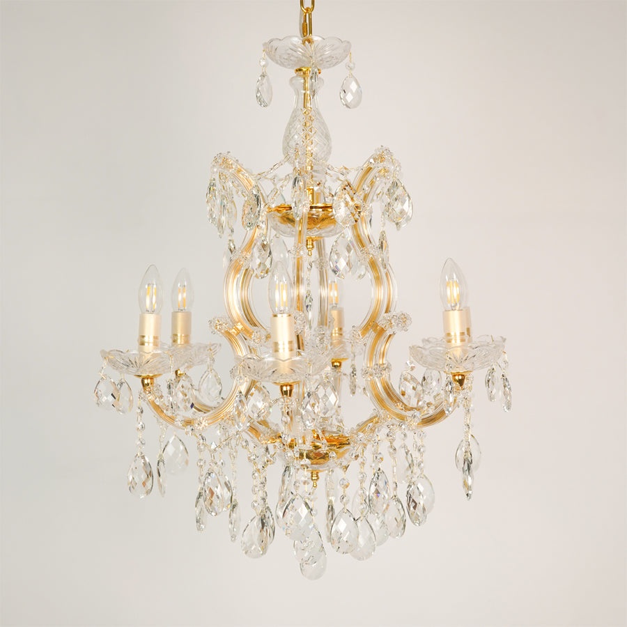 White background image of candelabra chandelier for elegant dining room decor styling with unlit arms.