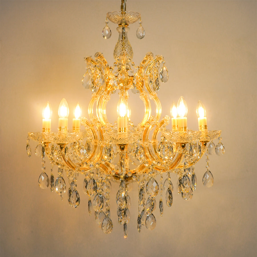 White background image of large candelabra chandelier for modern living room decor styling with a bright warm glow.