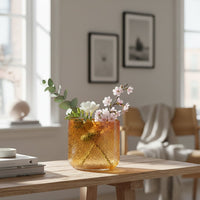 Amber textured glass planter styled on living room floor modern decorative glass accent for console corner or table styling home.
