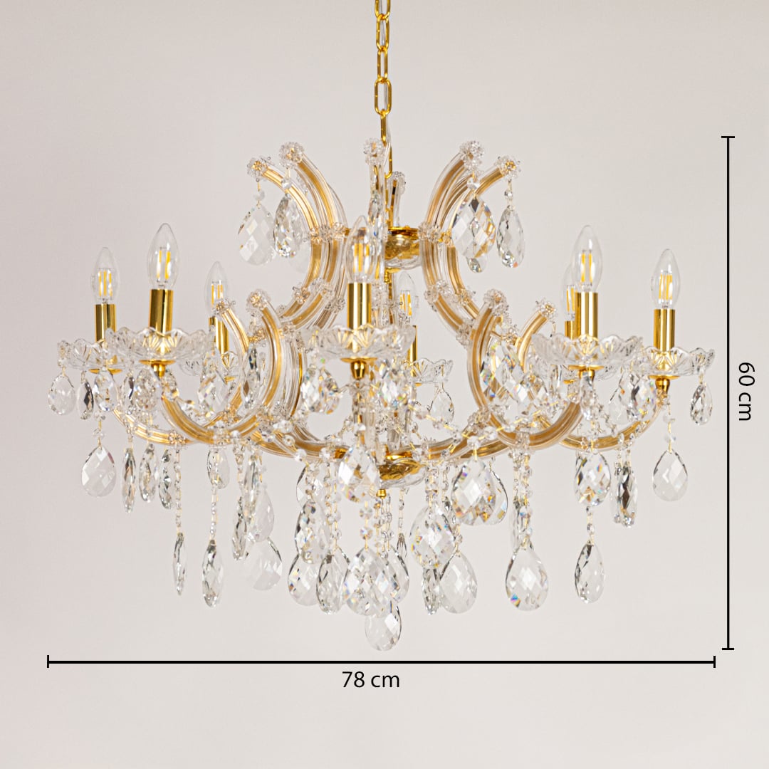 Gold crystal chandelier measuring 78 cm wide and 60 cm tall with sparkling drops ideal for living and dining lighting.