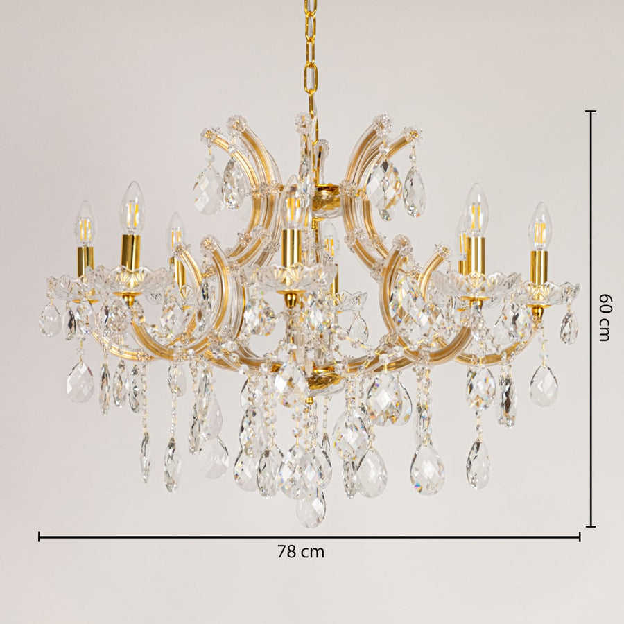 Gold crystal chandelier measuring 78 cm wide and 60 cm tall with sparkling drops ideal for living and dining lighting.