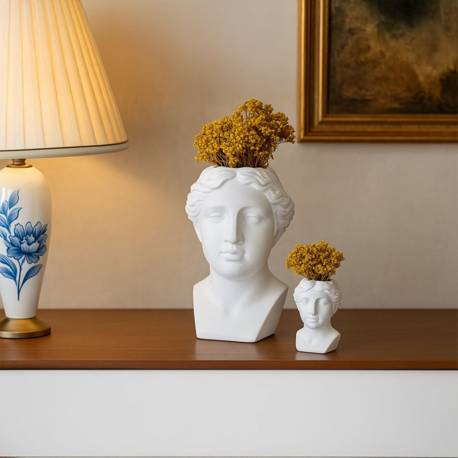 White artistic bust decor piece styled on modern white steps adding a sculptural elegant accent ideal for contemporary and minimalist interiors.