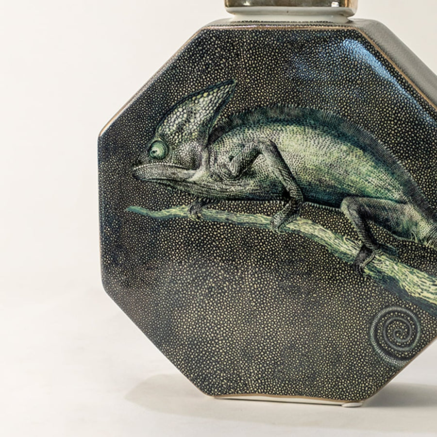 Dark green ceramic jar with engraved horse artwork in a front view perfect for rustic décor themes and stylish tabletop placement.