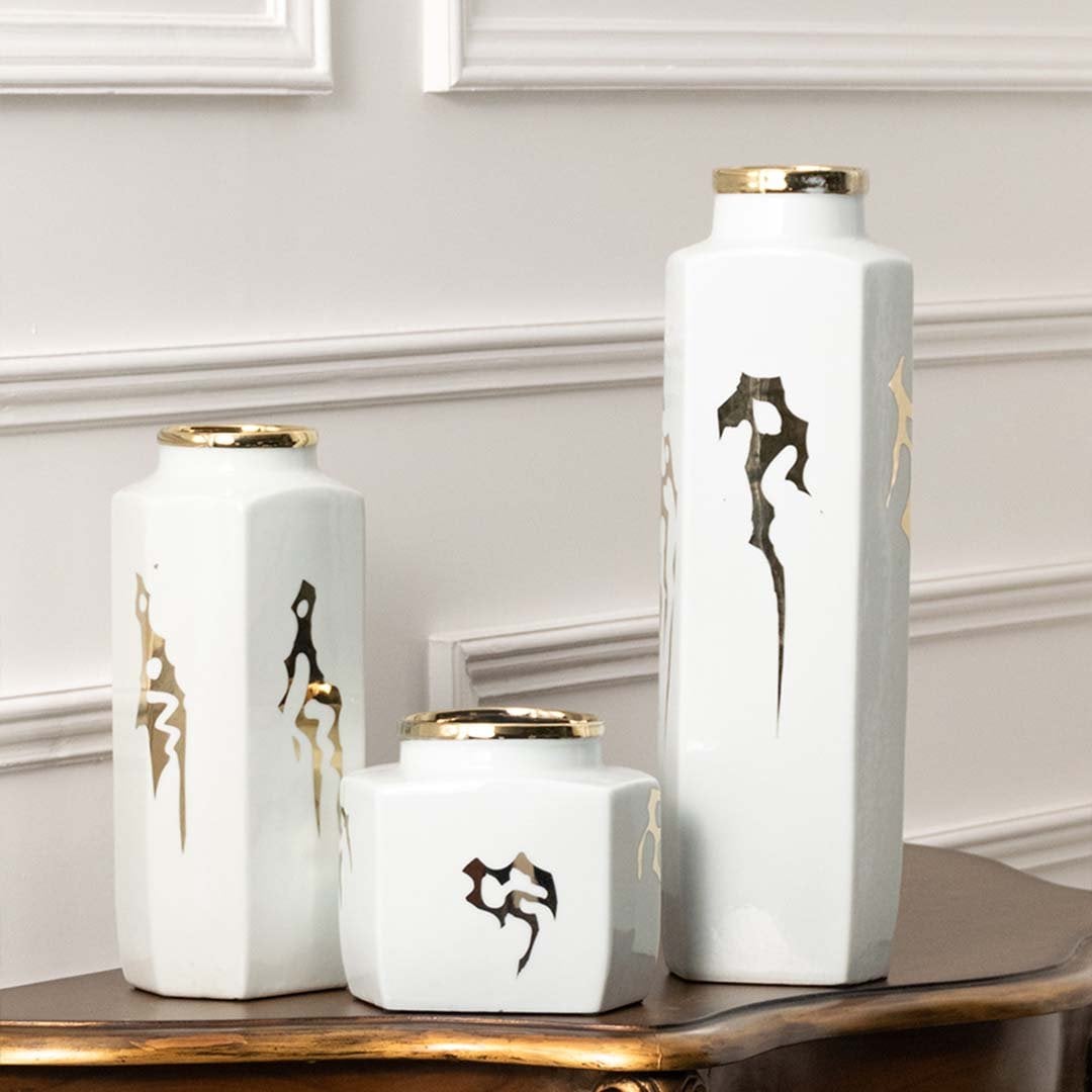 Set of white ceramic jars with black and gold horse artwork in a front view perfect for elegant console décor and stylish home accents.
