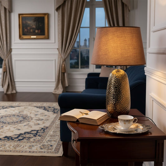 Textured table lamp styled beside sofa and tableware creating cozy ambient lighting and refined living room Decor mood.