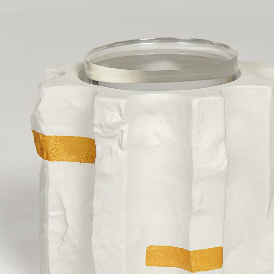 Detailed closeup of modern ceramic vase featuring matte white surface gold highlights and glass inner lining.