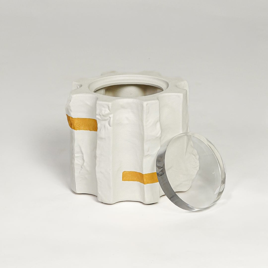 Contemporary white ceramic flower vase with gold accents isolated on clean white background for decor styling.