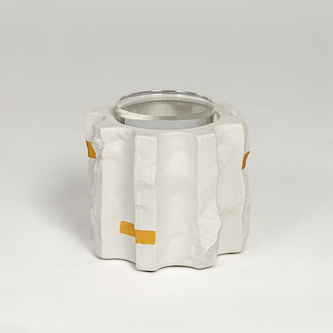 Modern white ceramic flower vase with gold accents and glass inner lining isolated on clean white background for home decor styling.
