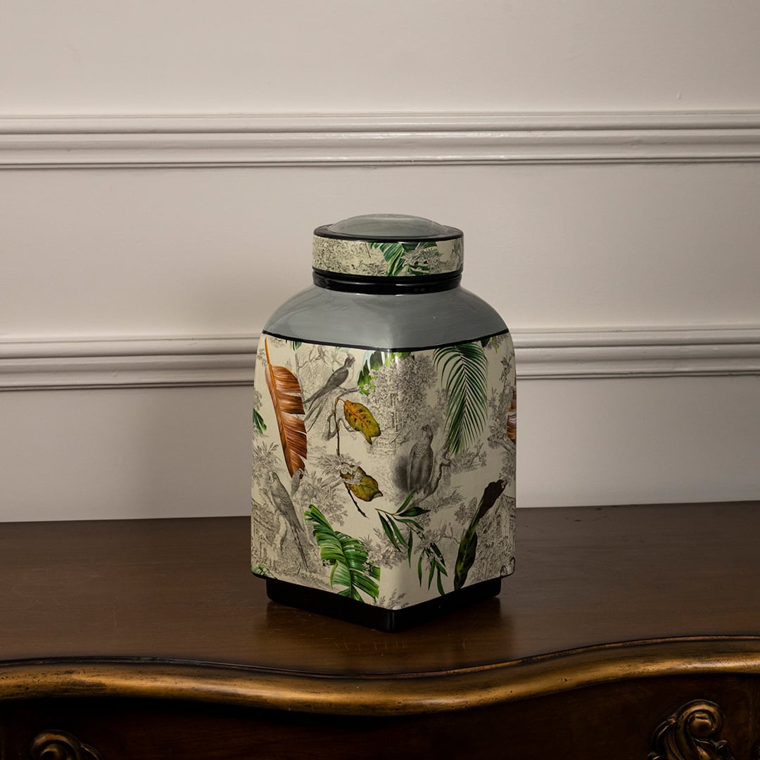 Tropical bird jar with on white background showing intricate tropical pattern.