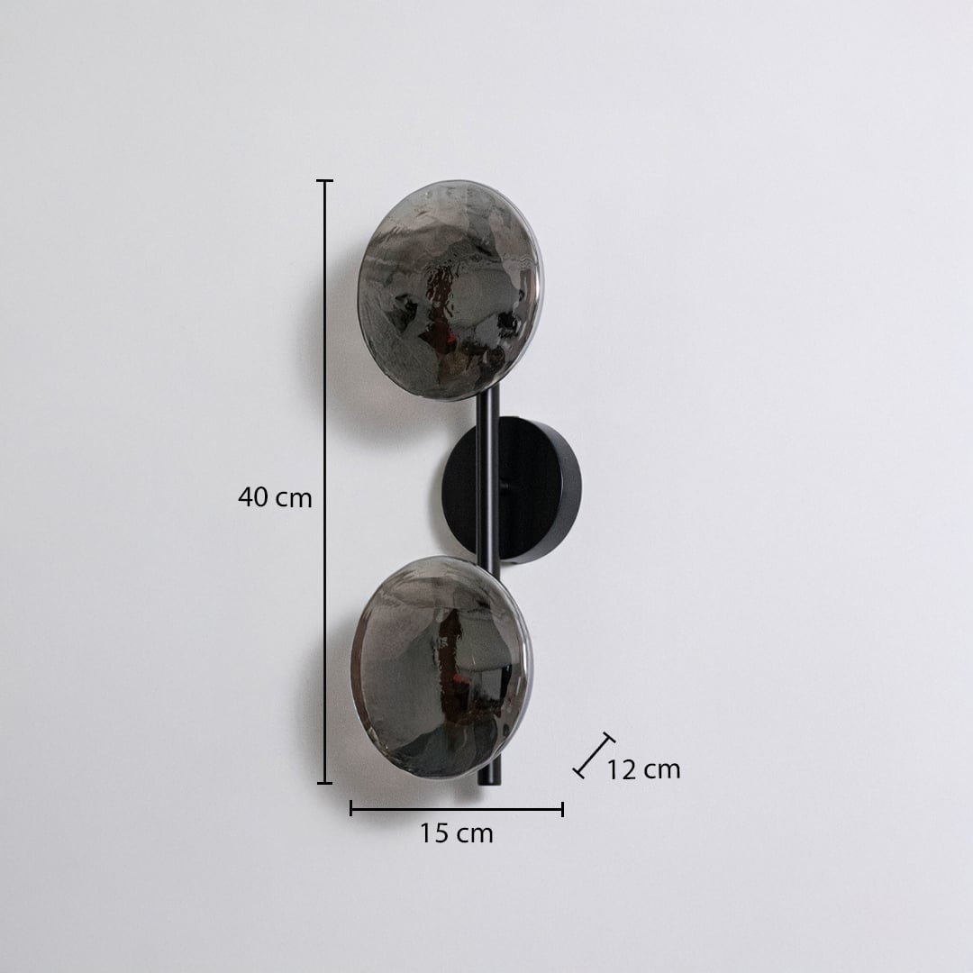 Modern black metal wall sconce with dual smoked glass globes showing 40cm height 15cm width 12cm depth on white background.