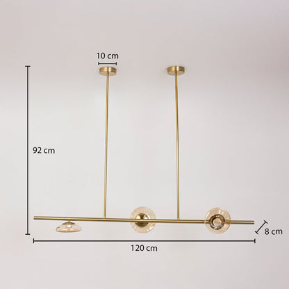 Golden metal chandelier with amber glass discs measuring 92 cm height and 120 cm width ideal for dining room ceiling decor.