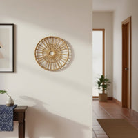 Handcrafted rattan wall plate displayed above a beige sofa with neutral tones adding rustic charm to modern interiors.