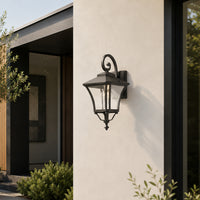 Classic black metal and glass outdoor wall lantern for balcony porch entrance and exterior walls with warm lighting.