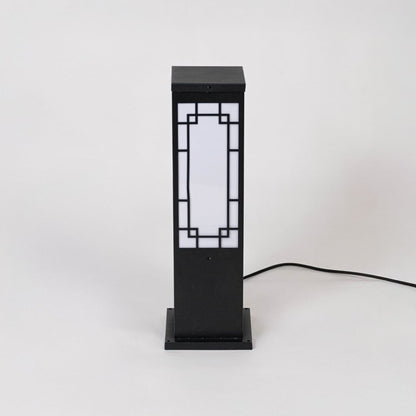 Sleek black pillar light with frosted glass shade displayed off on white background for contemporary look.