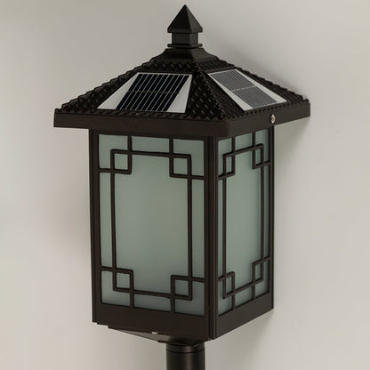 Closeup of brown solar spike lantern showing frosted patterned glass and decorative metal frame suitable for warm ambient garden lighting.