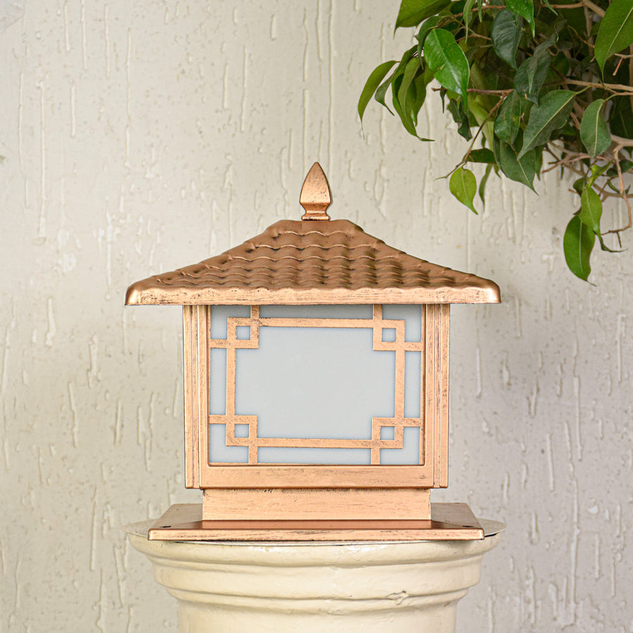 Modern outdoor pillar light with wooden texture and geometric frame design on clean background creating warm ambient lighting.