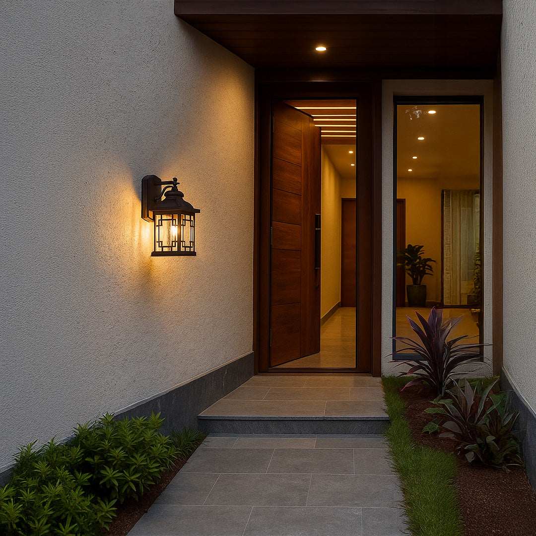Outdoor wall light mounted on exterior wall illuminating entrance pathway with warm glow.