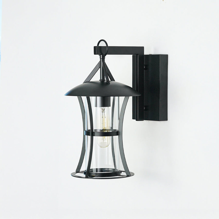 Classic black outdoor wall lantern with clear glass panels mounted on neutral wall ideal for patio or exterior home lighting decor.