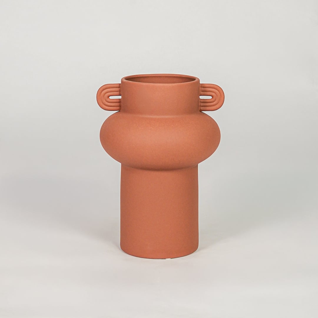 Orange ceramic decorative flower vase with matte finish modern vase for tabletop shelf console living room home decor styling.