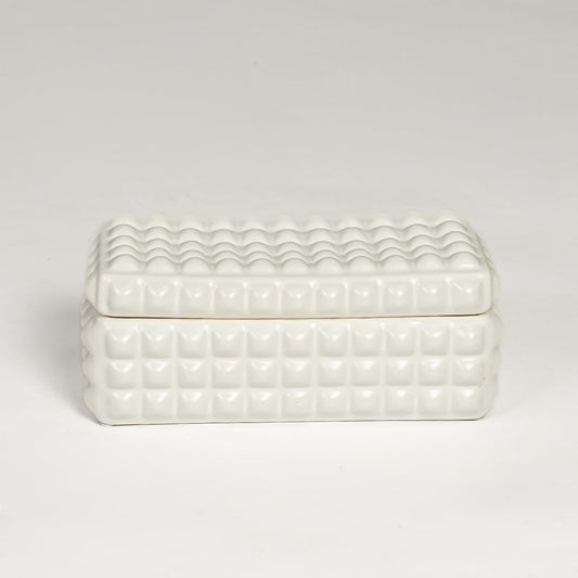 White ceramic textured storage box with geometric pattern and fitted lid isolated on white background for elegant decor use.
